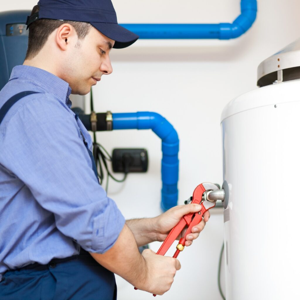 plumber working on water heater