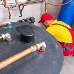 plumber fixing water tank