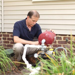 plumber fixing well pump