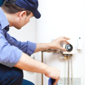 plumber fixing water heater