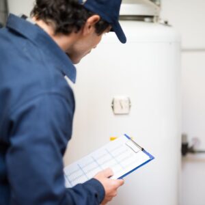 plumber inspecting water heater