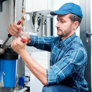 plumber fixing well pump